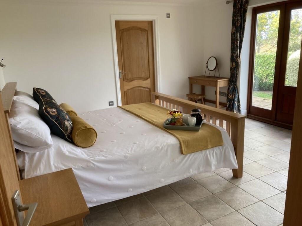 Large bedroom opening onto a private garden